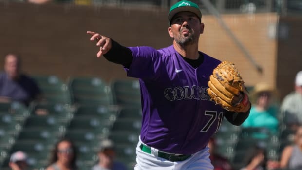 Colorado Rockies third baseman Colton Welker makes the play for an out against the Arizona Diamondbacks in the fifth inning. (2022)